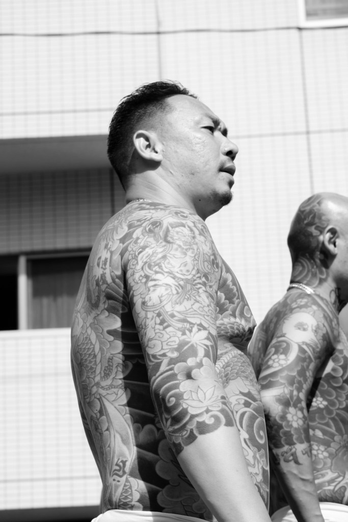 Profile of a yakuza member with his irezumi