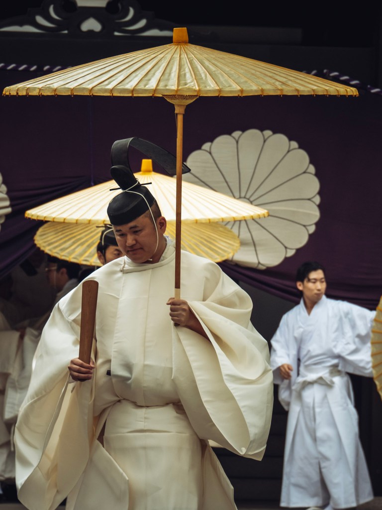 The priest going to find is place in line for the final part of purification rite at yasukuni jinja